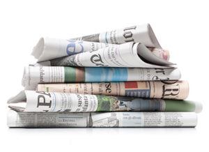 In the News - Pile of Newspapers