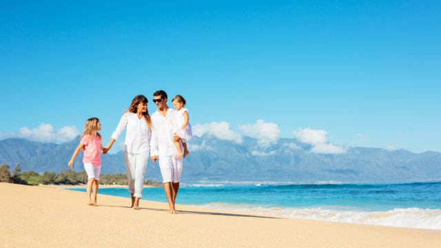 Happy Family on the Beach in Summer