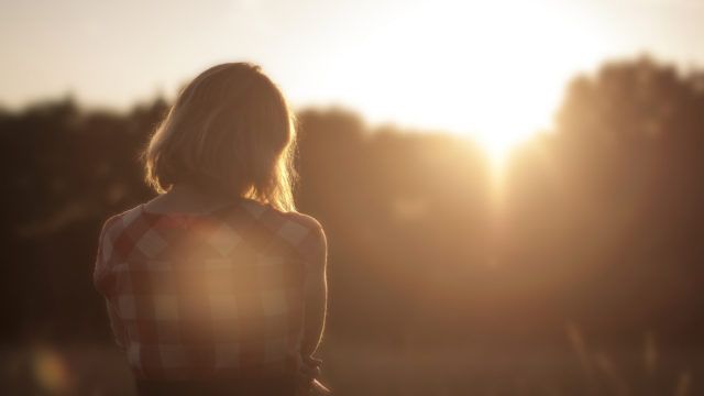 A girl contemplating the future in the sun