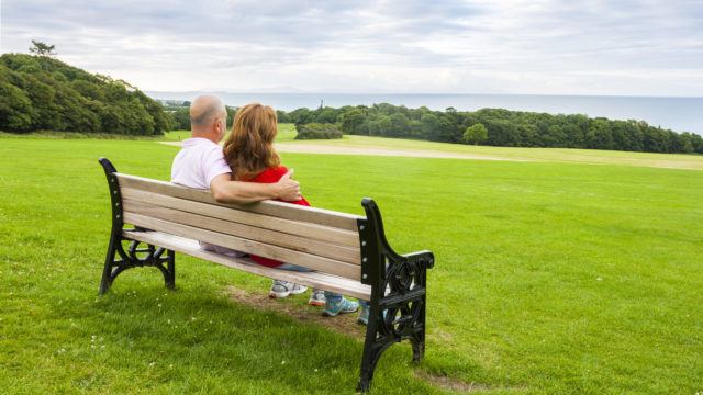 Enjoying retirement on a bench looking out to sea