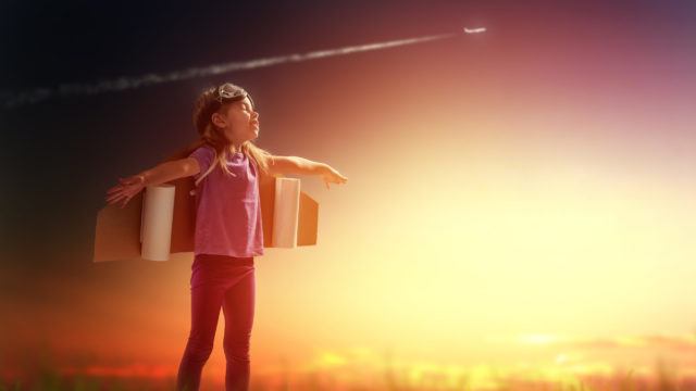 Child with wings dreaming of flying free