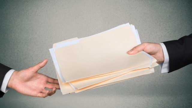 A file of data being handed over