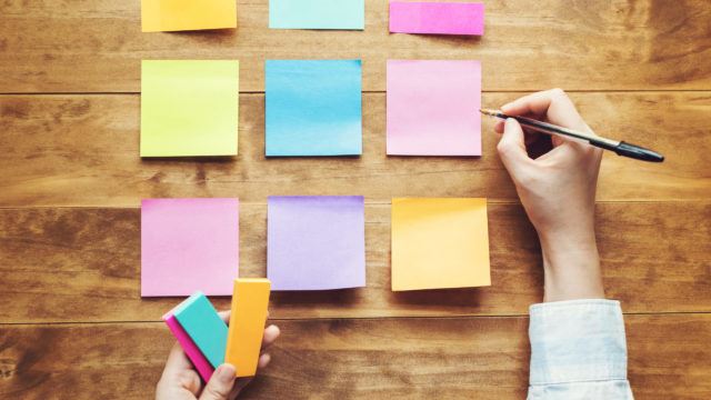 Person organising things at a desk