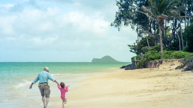 Girl And Grandad At The Beach