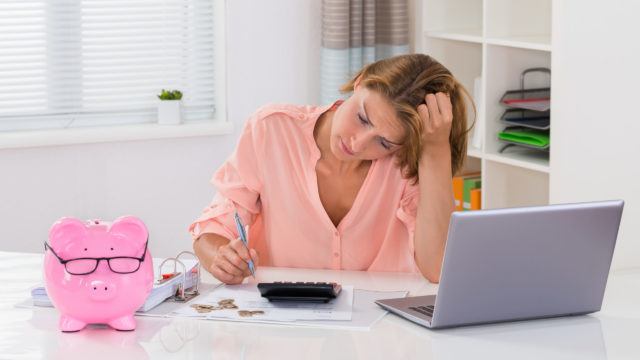 Young Woman Calculating Finance