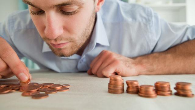 Businessman counting coins