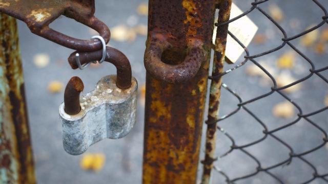 Old gate with broken lock