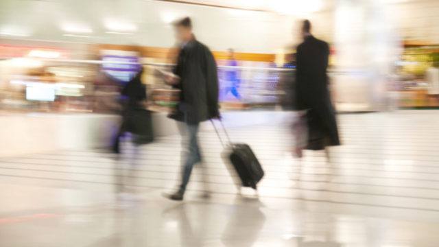 Man at airport transferring flights