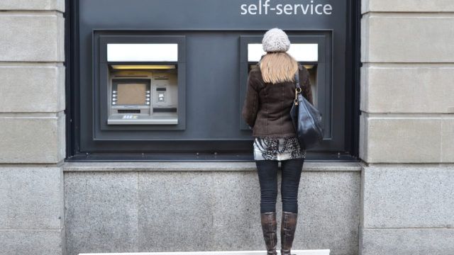 Woman at a cash machine