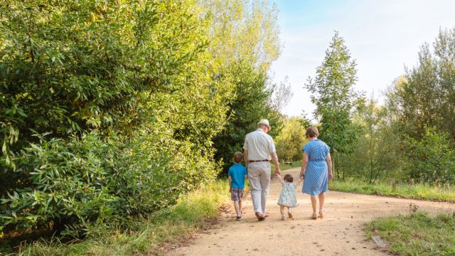 Grandparents and grandchildren walking outdoors