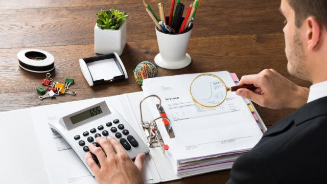 Businessman inspecting documents