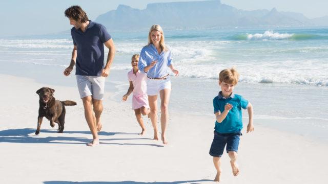 Family running with dog