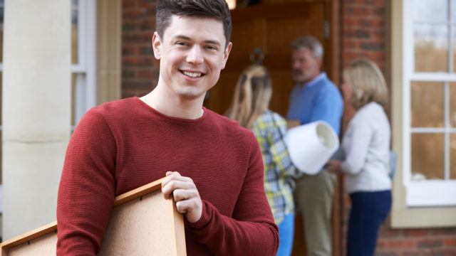 Parents Helping Adult Son To Move Into Home