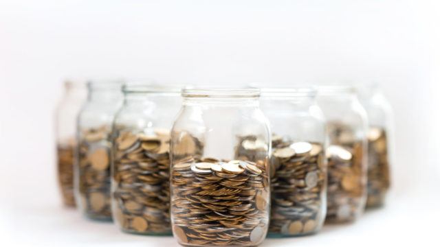 coins in a three glass jars