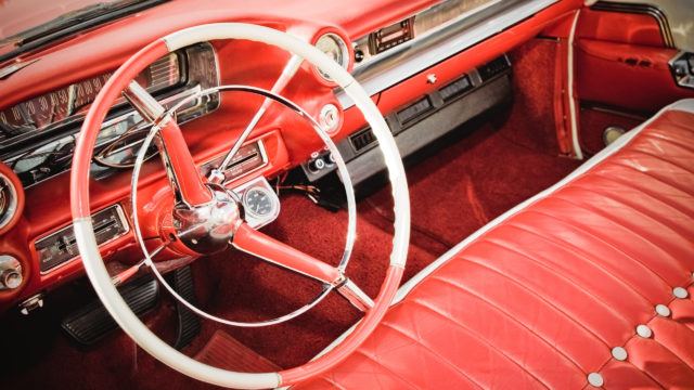 classic car interior with red leather upholstery