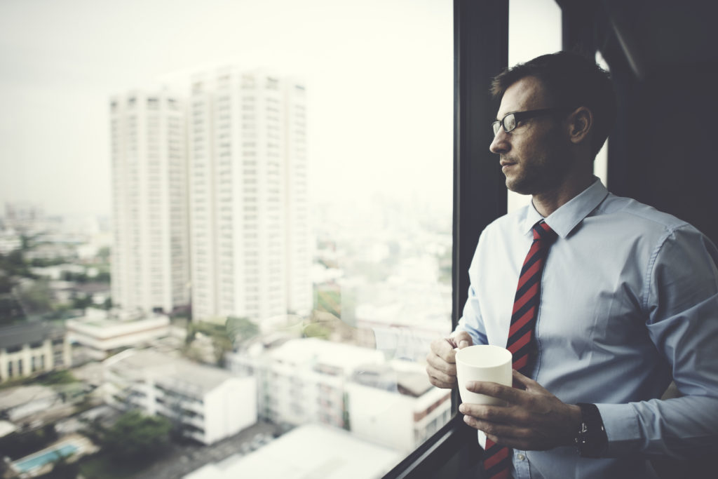 Businessman Holding coffee Thinking Relax Concept
