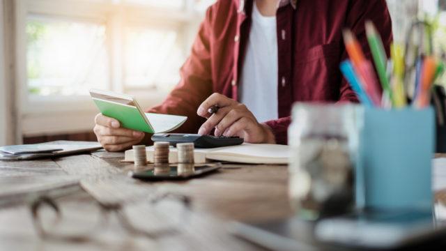 man holding savings account passbook