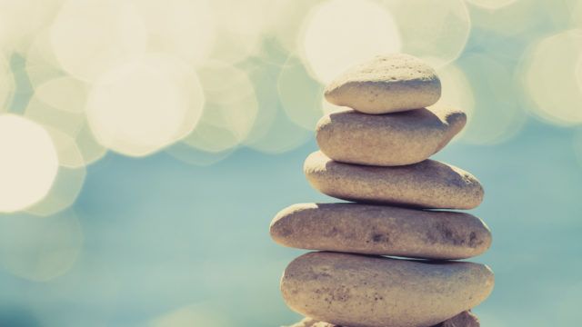 A cairn with an abstract background.