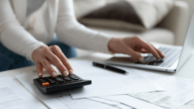 woman paying bills at a computer