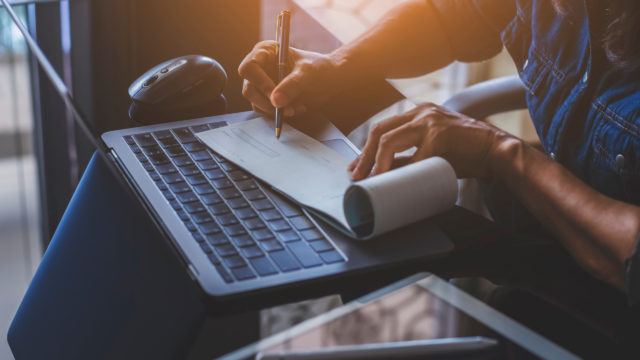 business woman writing a cheque