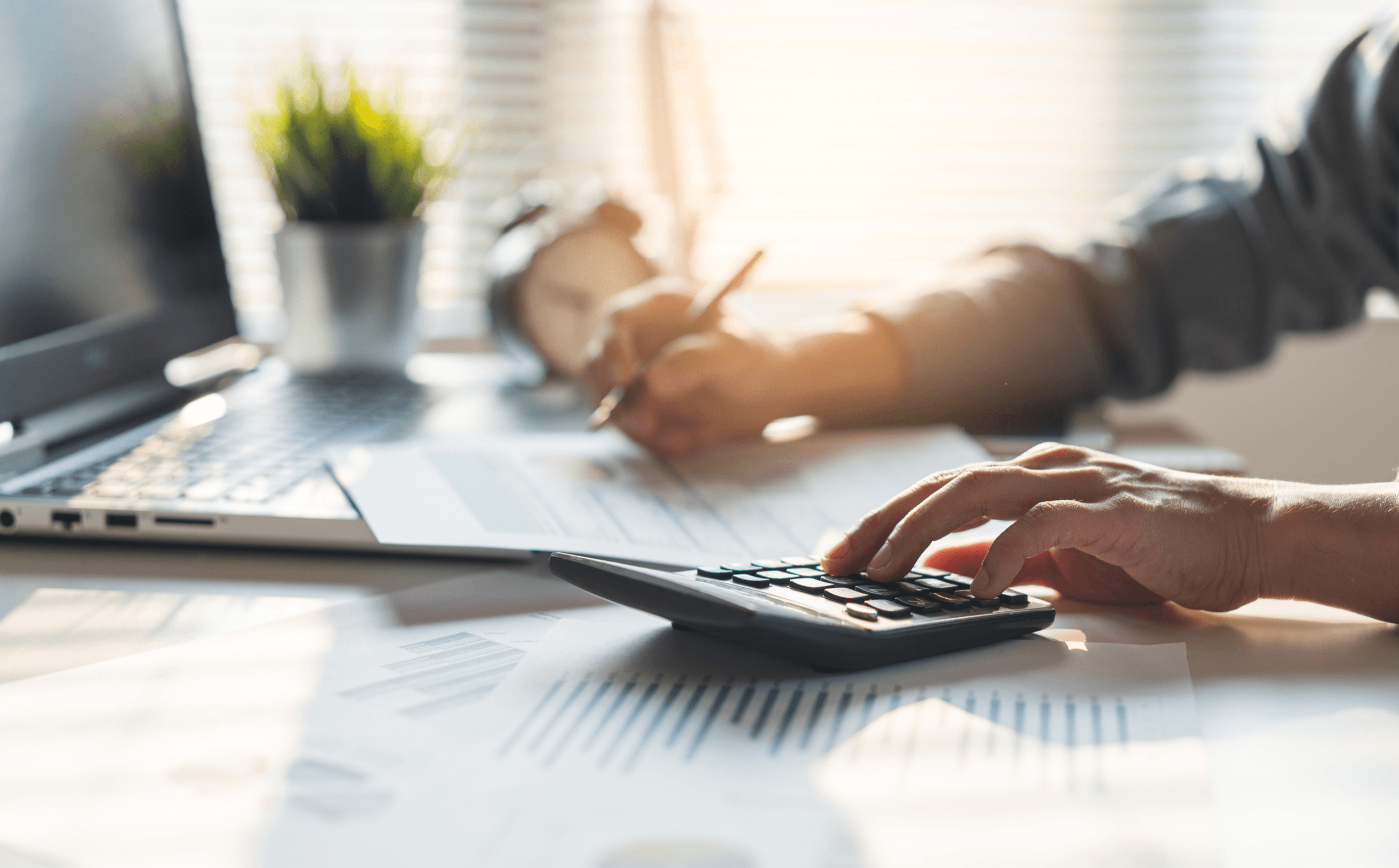 person calculating tax form