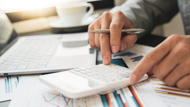 man using a calculator