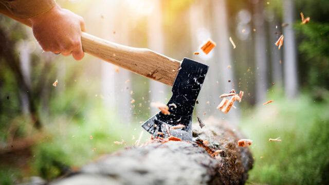 a person chopping wood with an axe