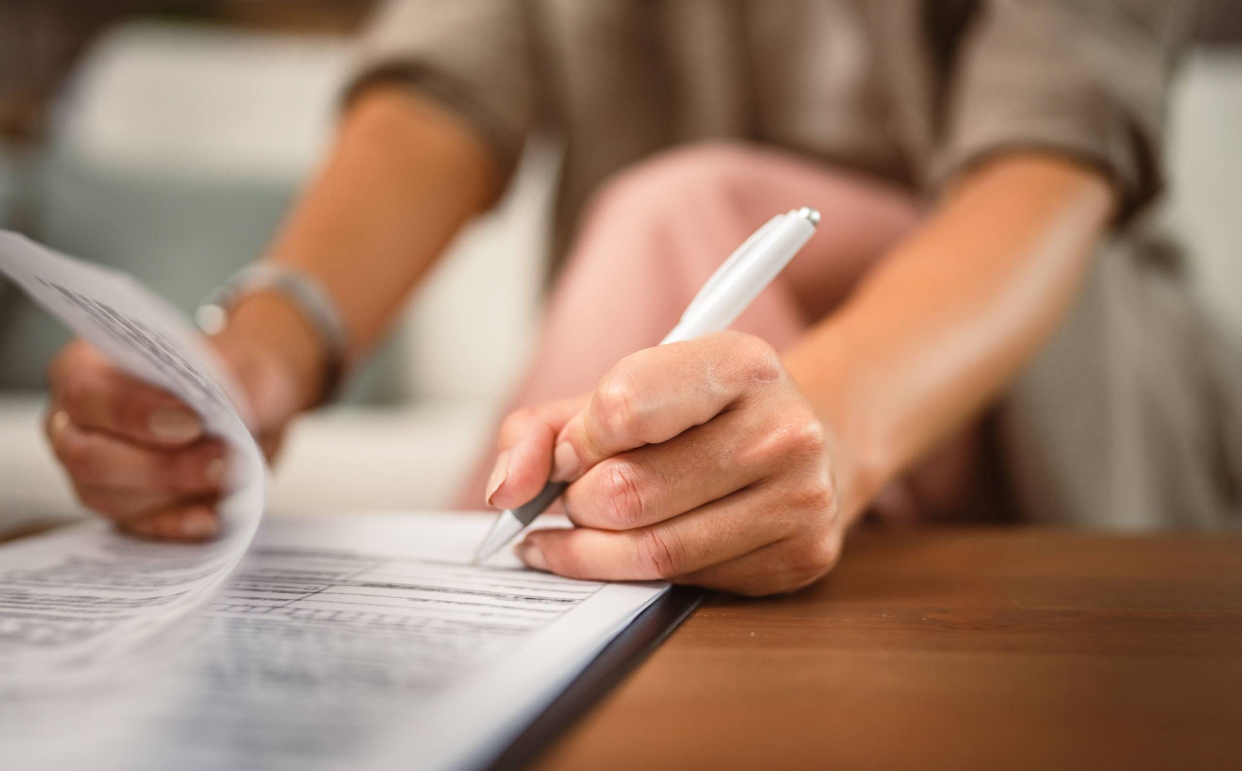 woman signing document