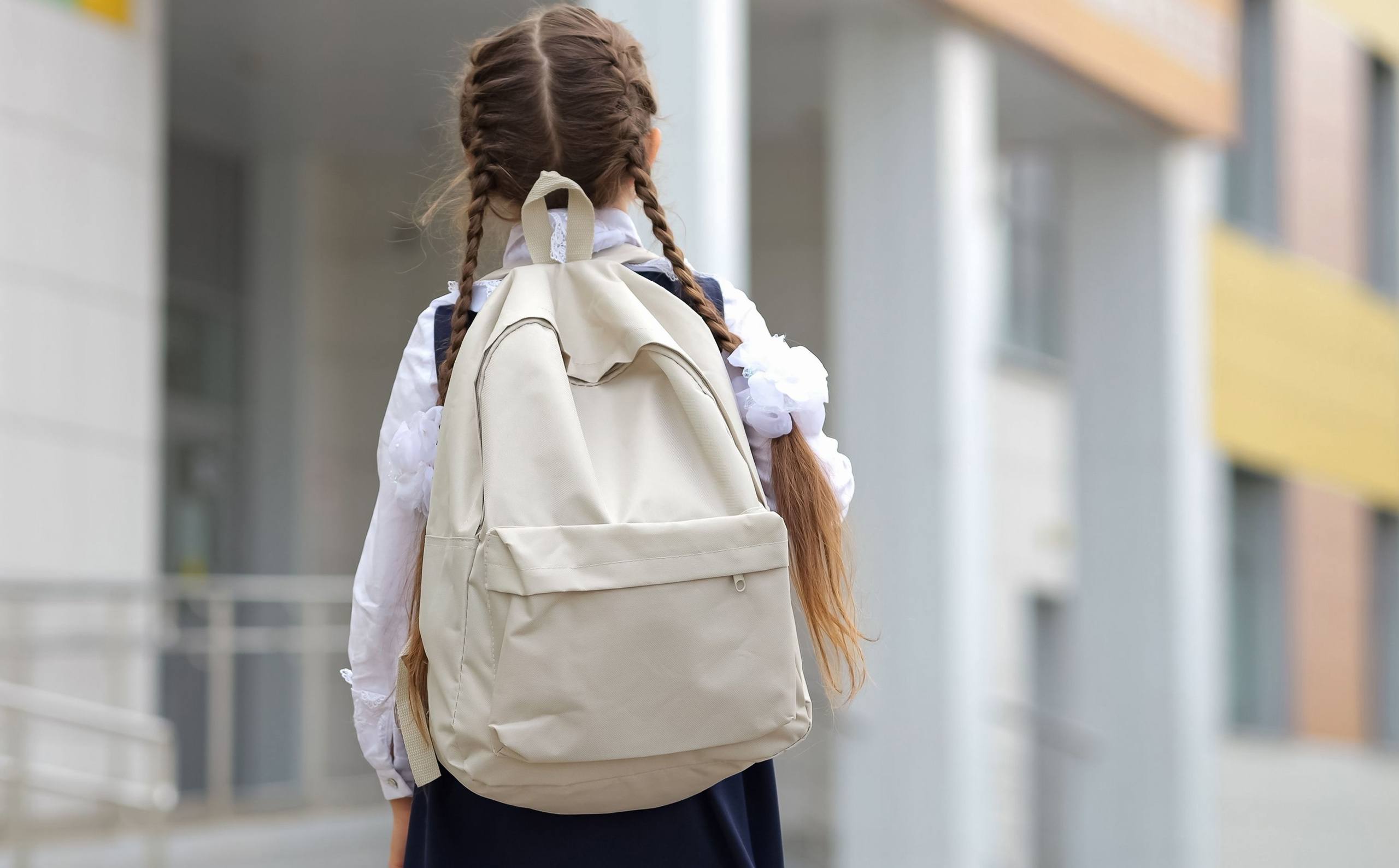 young girl going to school