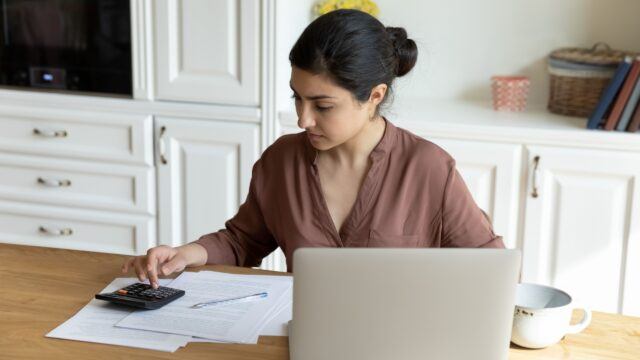 A woman doing some calculations.