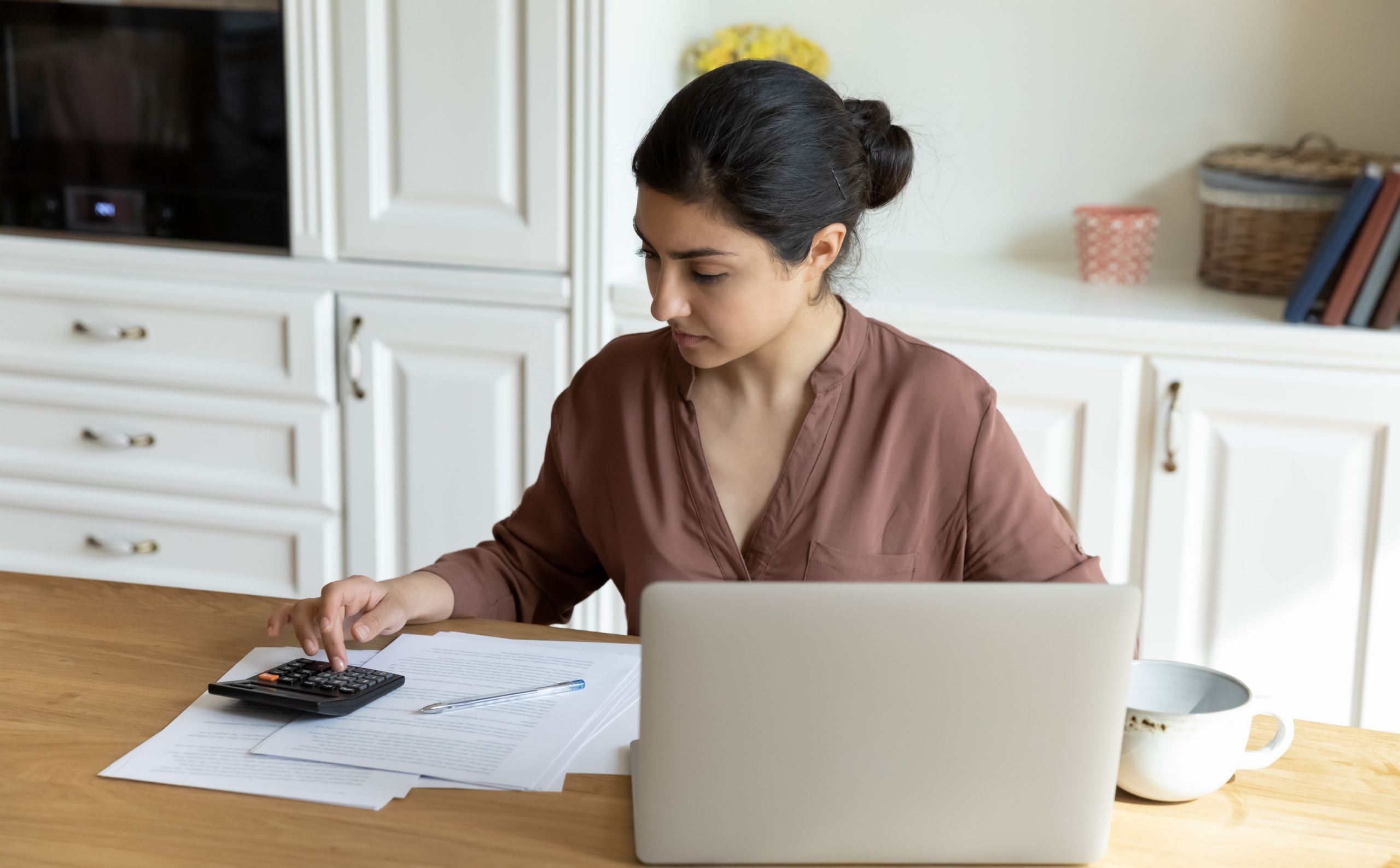 A woman doing some calculations.