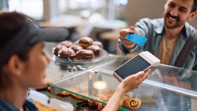 A man paying for pastries.