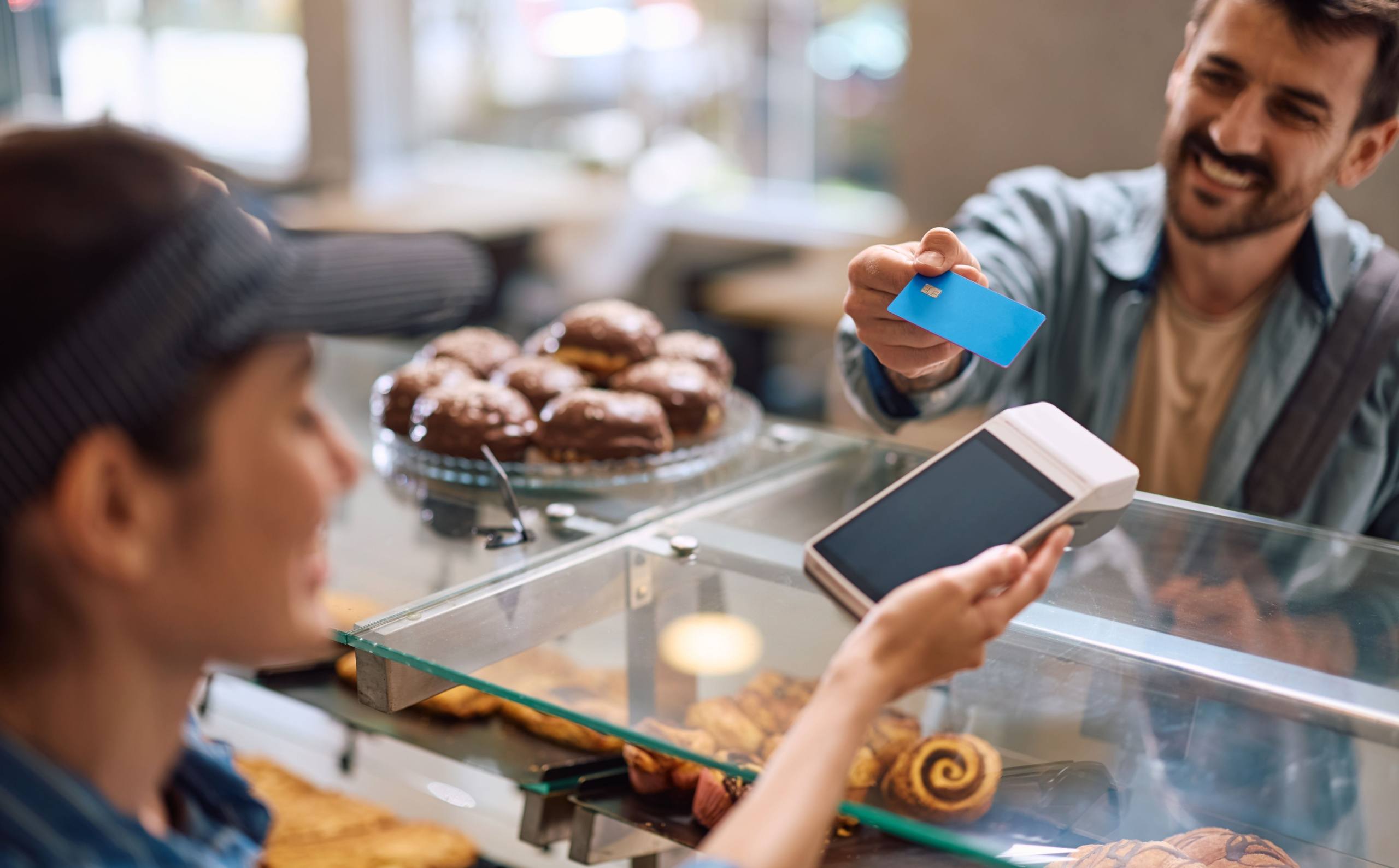 A man paying for pastries.