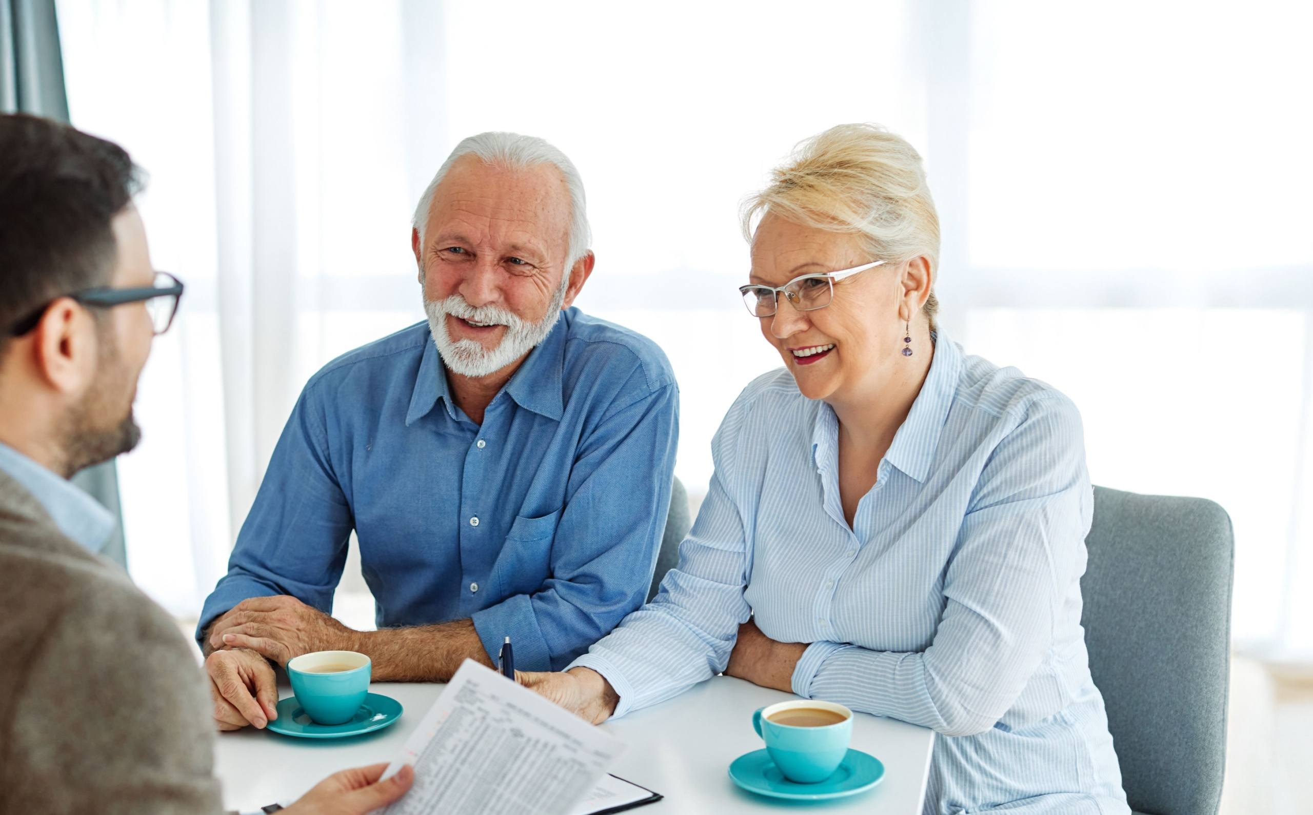 Home Senior couple in a meeting with their financial planner
